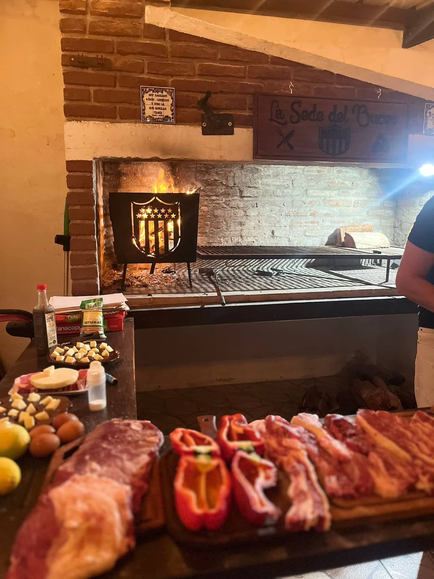 Beef cuts, peppers and provolone prepared beside the wood fire